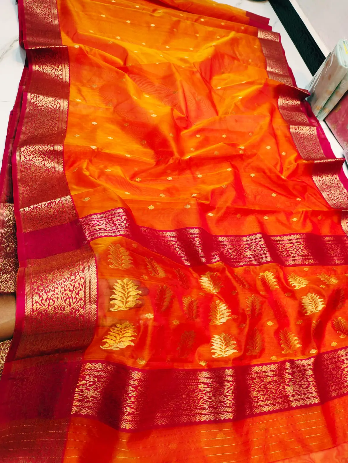Saffron Sunset with Intricate Leaf Motifs and Crimson Zari Border Kataan Silk - Handloom Chanderi Saree